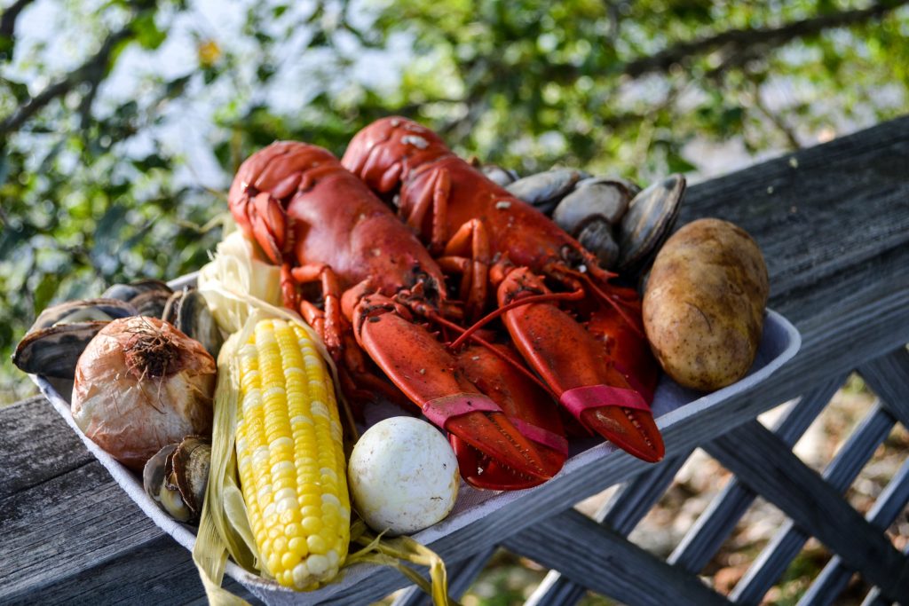 Maine Lobster, Corn, Potato on dish outside